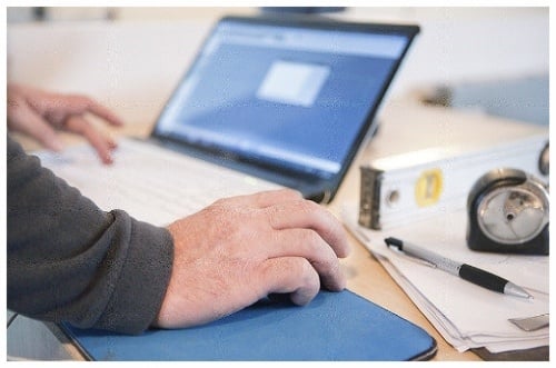 Man at computer iStock_000033072552-431358-edited